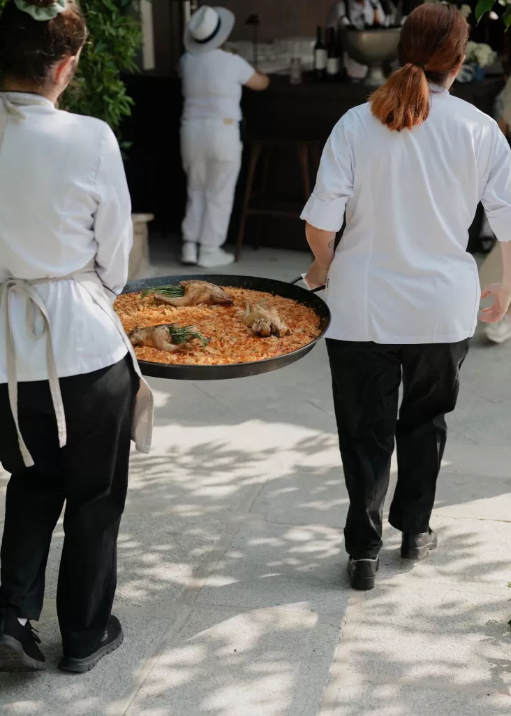 Chefs serve a traditional Spanish paella during the wedding at Cigarral de las Mercedes.