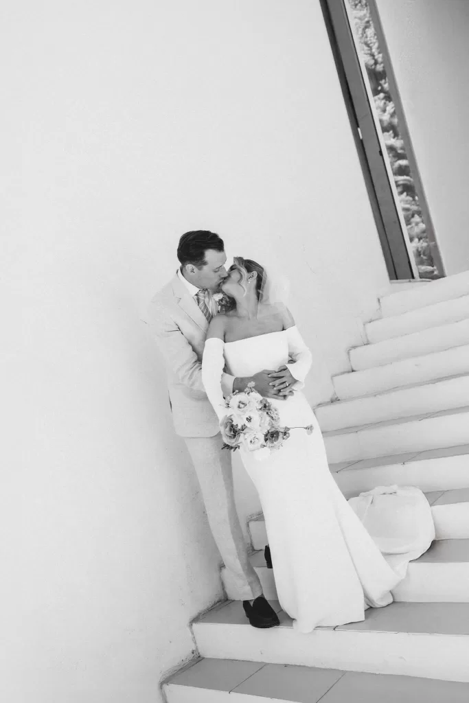 Couple walking together on staircase at Casa Sacoto