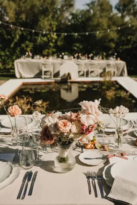 Floral centerpiece placed by the pond at Casa Sacoto