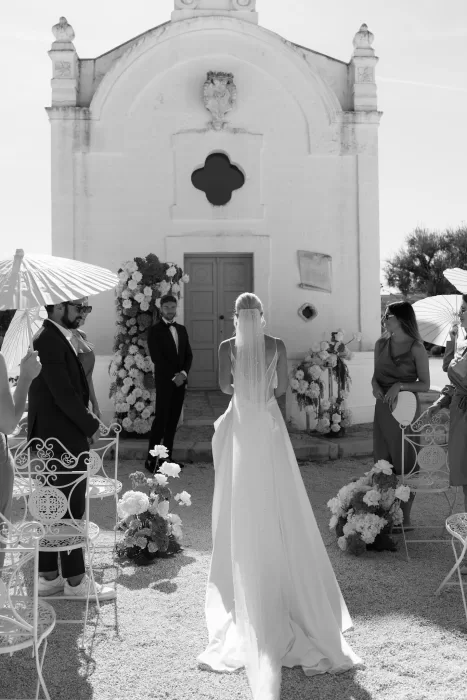 Bride walking down the aisle during outdoor ceremony at Masseria San Giovanni