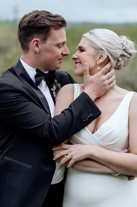 Close-up of the bride and groom sharing an intimate moment on their wedding day at Borgo Sant'Ambrogio.