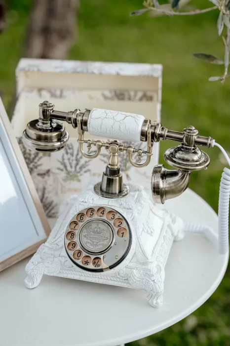 Vintage guestbook telephone on a white table at Borgo Sant'Ambrogio wedding.