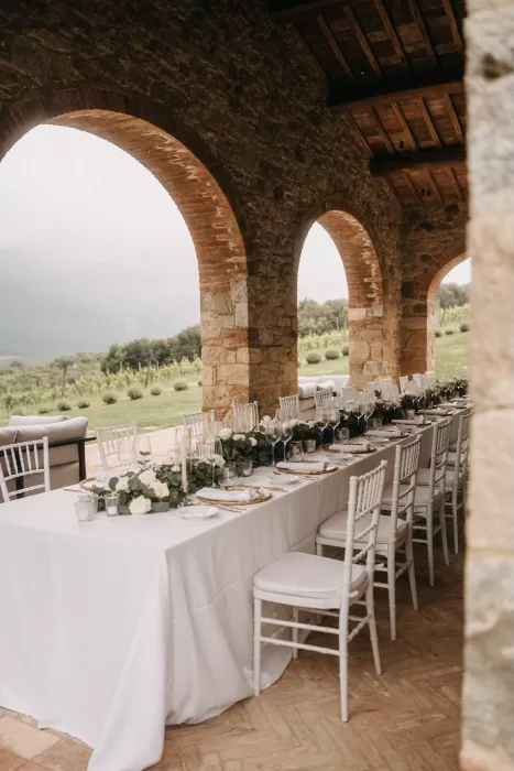 Sweeping aerial view of Castello di Casole’s rustic villa and green Tuscan surroundings.