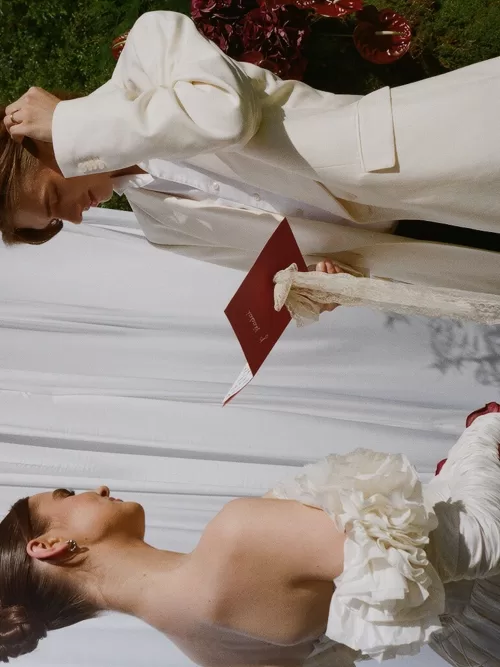 Intimate vow exchange at Treelove Parkas with the couple facing one another beneath a draped white backdrop.