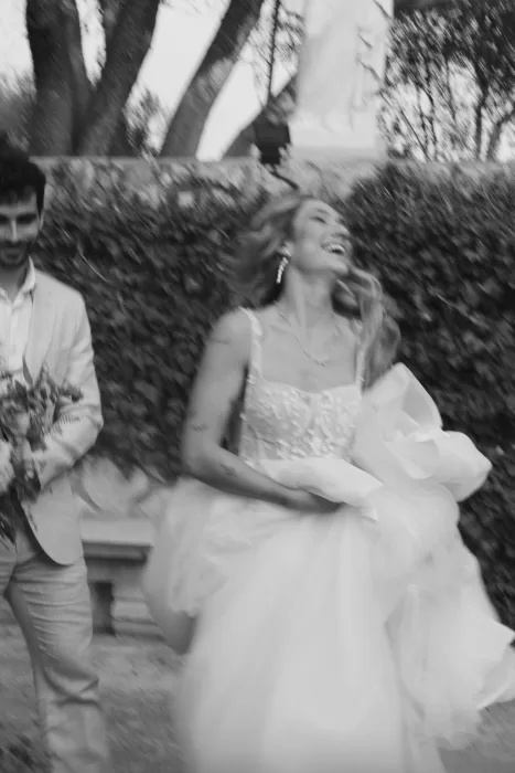 Joyful black and white photo of the bride laughing with the groom during their wedding at Finca Son Collell