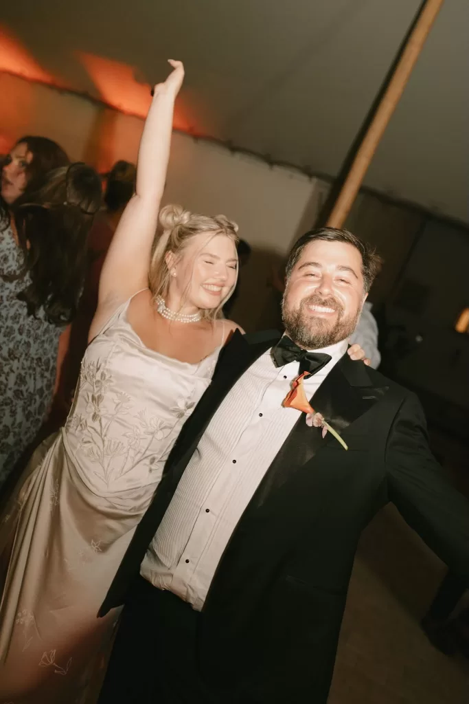 Bride and groom laughing and dancing during the evening party at Masia Cabellut