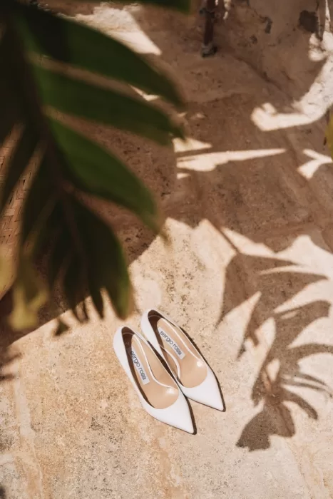 White Sergio Rossi bridal heels in soft natural light at Masseria Calderisi