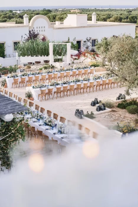 Long banquet tables set for an al fresco celebration at Masseria Calderisi