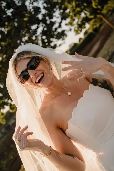 Close-up of the bride showing her wedding rings in golden hour light at Masseria Monitilli.
