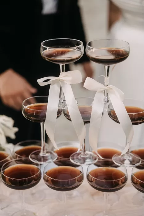 Tower of espresso martinis tied with white bows during the reception at Villa Olimpia