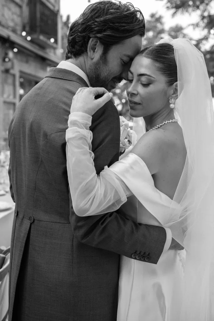 The bride and groom share a quiet embrace at Cigarral de la Mercedes, lost in the intimacy of the moment.
