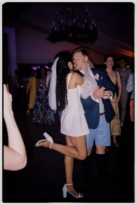 Couple sharing a kiss on the dance floor at Cigarral de las Mercedes wedding reception.