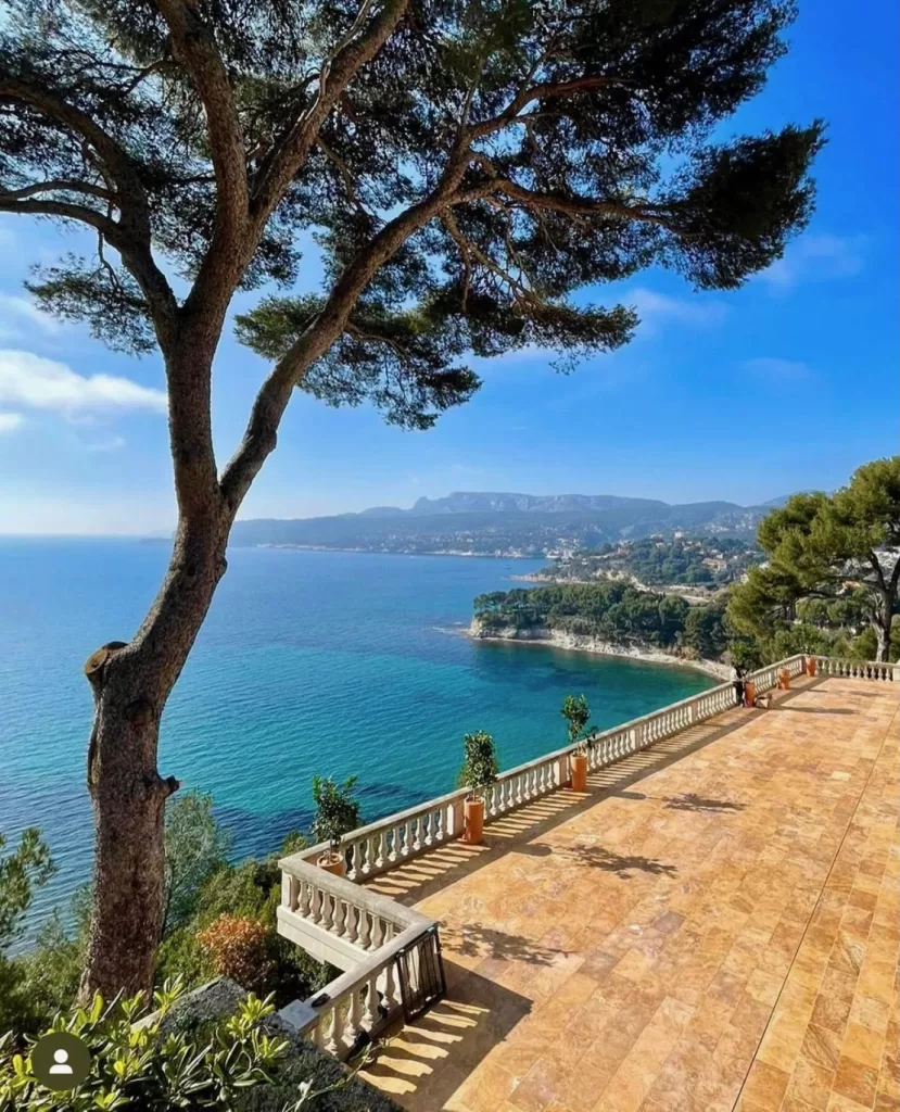 Expansive stone terrace overlooking the Mediterranean coastline at Domaine de Canaille.