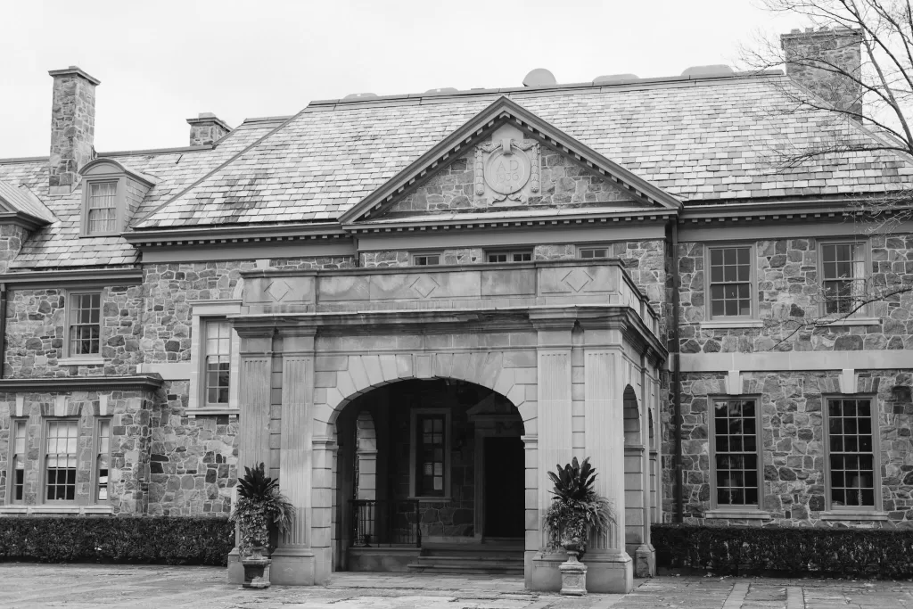 Black and white photo of the historic Graydon Hall stone exterior and arched entrance.