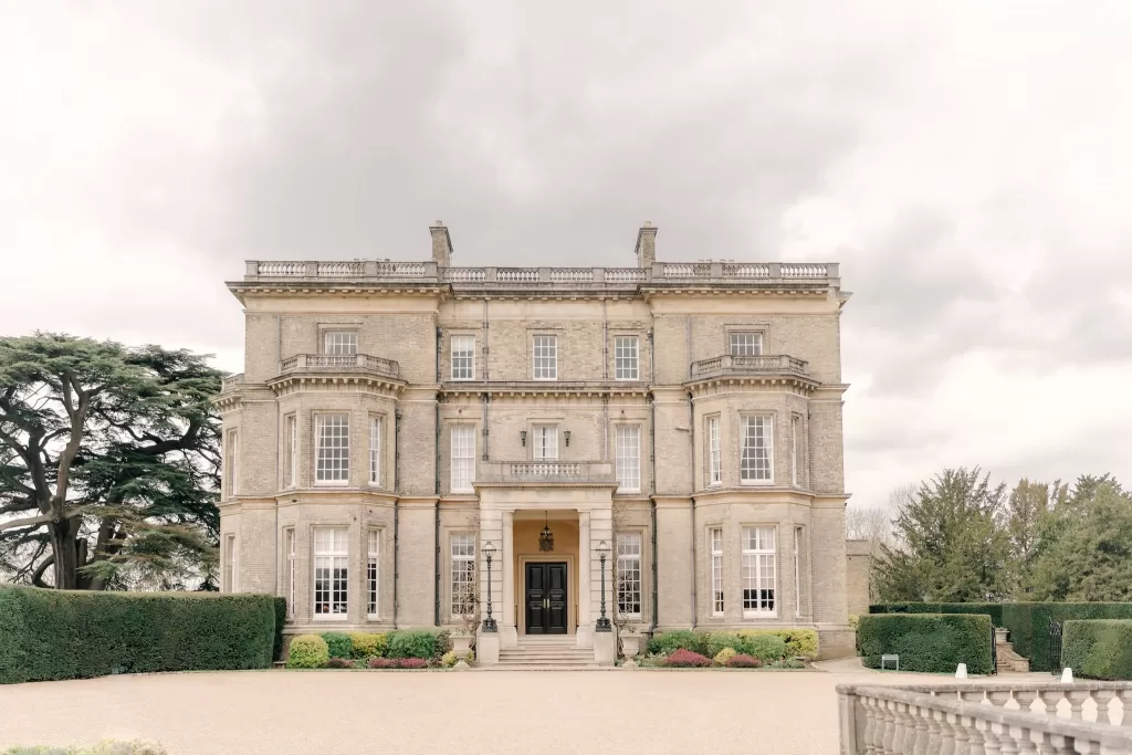 Exterior view of Hedsor House, a stately Georgian mansion surrounded by gardens.