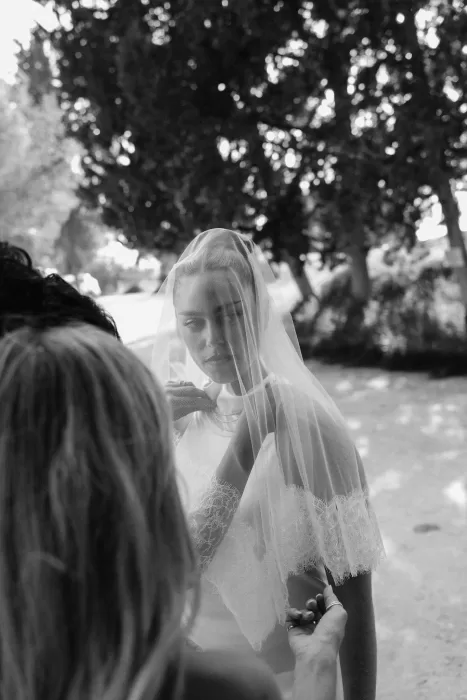Groom laughing joyfully during the wedding speeches at Minthis Resort.