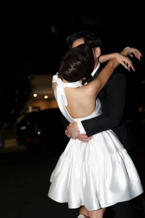 Bride and groom sharing an intimate embrace during their first dance.