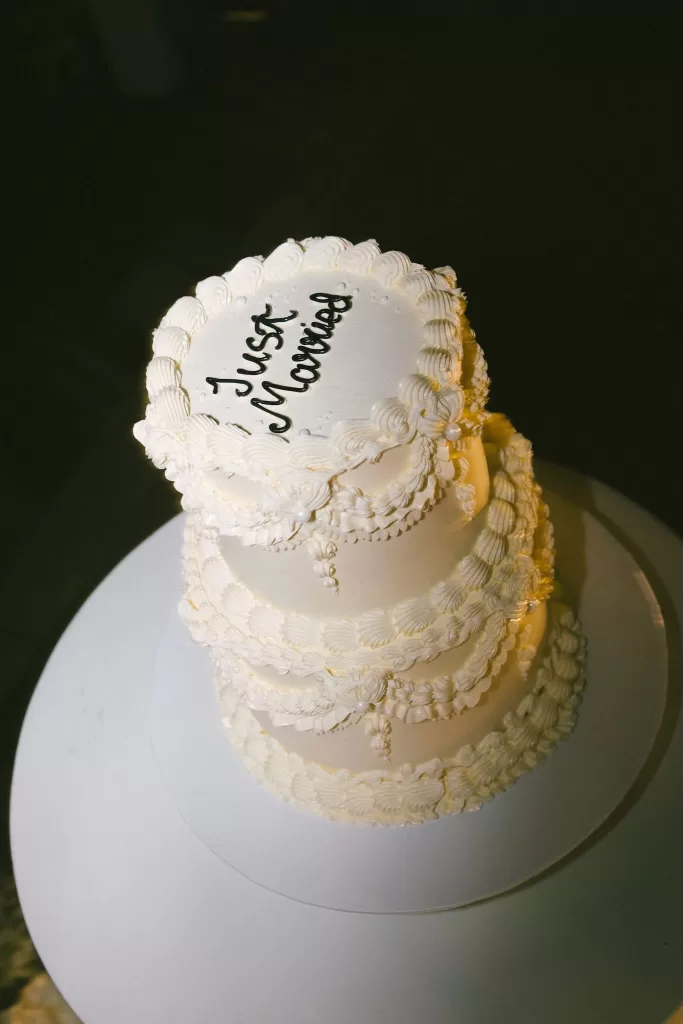 Elegant three-tier wedding cake with “Just Married” written on top at Padma Resort Legian.