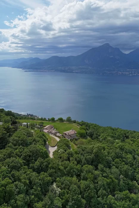 Aerial view of Rustico Bertel overlooking Lake Garda and the surrounding mountains.