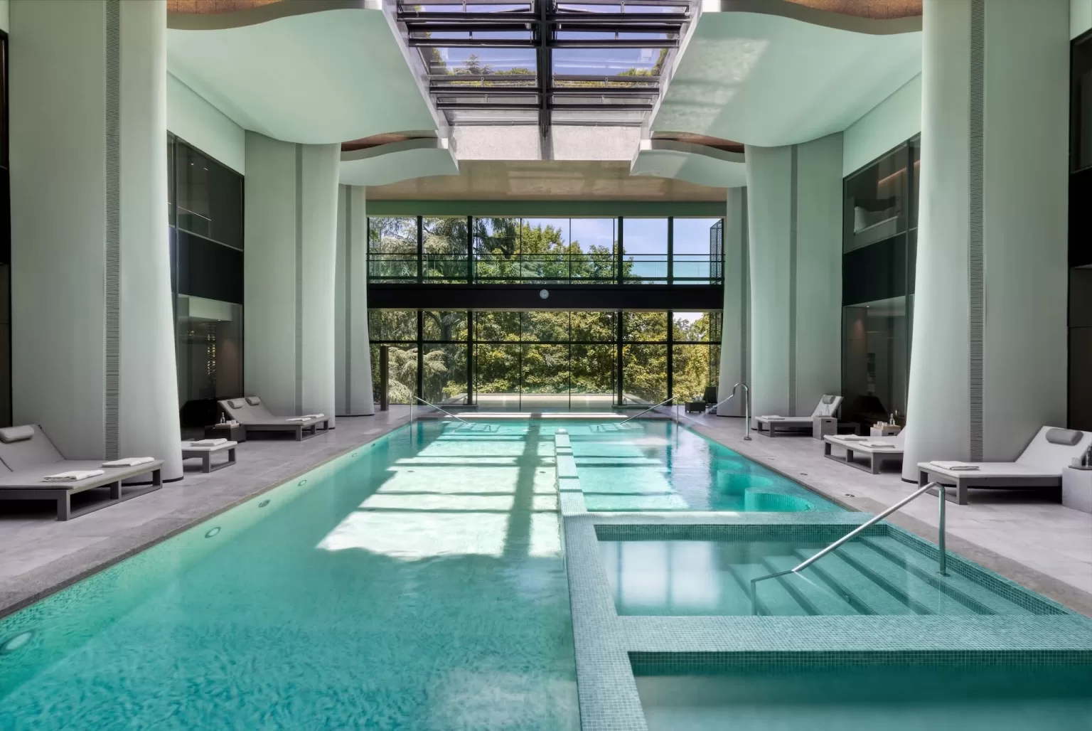 Indoor spa pool at Six Senses Douro Valley with natural light and modern relaxation space.