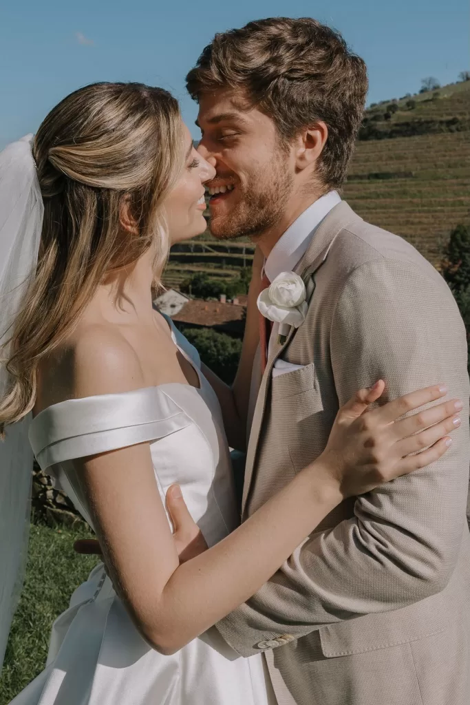 Close-up of bride and groom about to kiss in sunshine at Six Senses Douro Valley.
