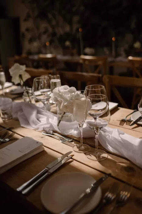 Elegant wedding table setting with flowers and candles at Middleton Lodge reception.