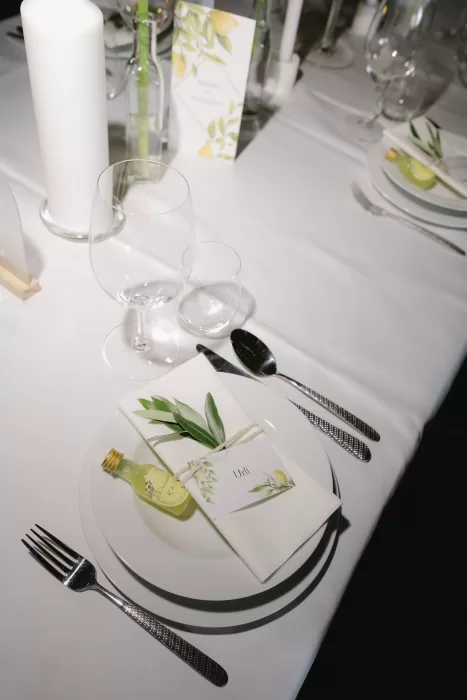 Wedding place setting with menu, name card, and limoncello favour at Winery Hans Igler.