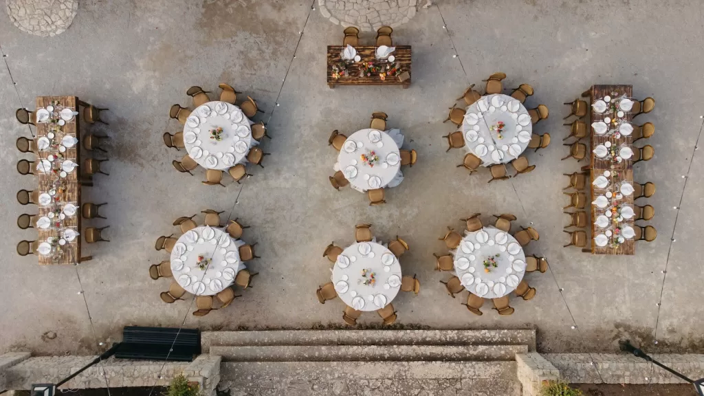 Aerial view of round and long tables set for a wedding dinner at Finca Son Collell