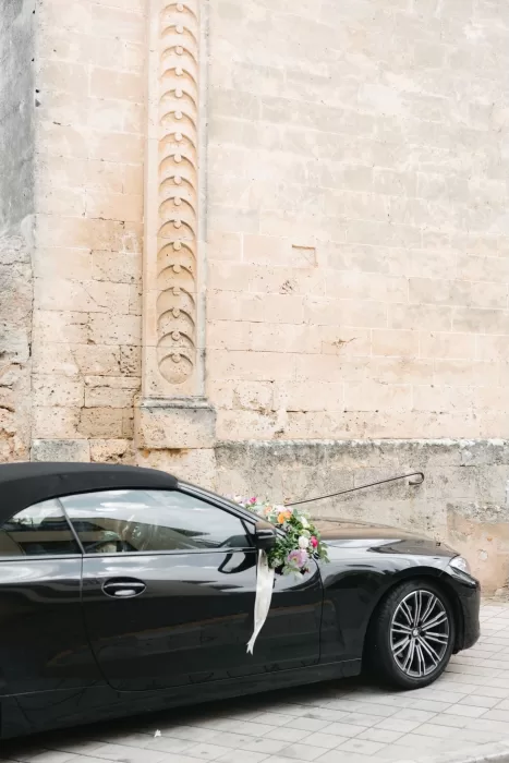 Black convertible adorned with flowers for a wedding at Finca Son Collell