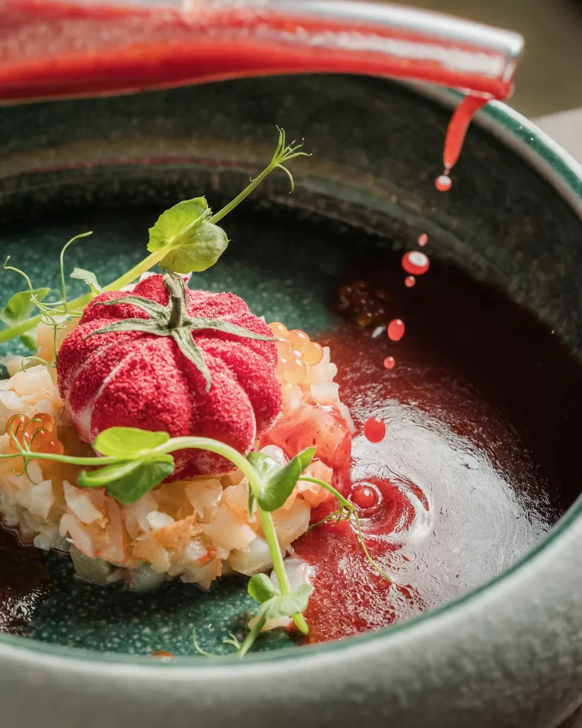 Gourmet dish with artistic presentation served at Hospes Maricel & Spa restaurant.
