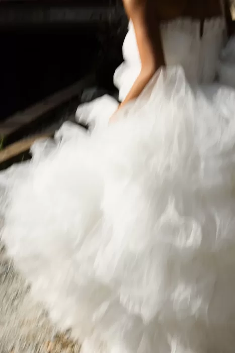 Artistic blurred detail of a layered tulle wedding gown at La Finka 4.1.