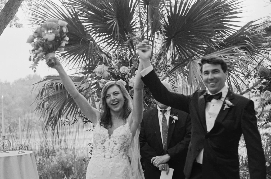 Bride and groom celebrating joyfully after their ceremony at Laguna Gloria.