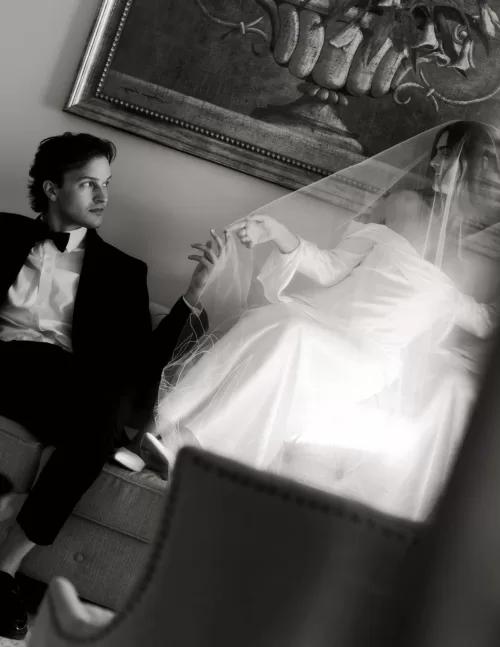 Artistic black and white photo of the bride under her veil with the groom gazing at her at Stone Haven.