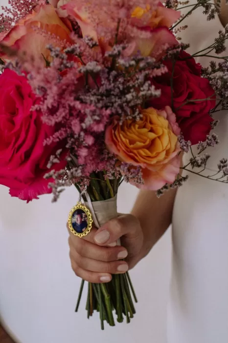 Wedding bouquet of roses and peonies with a keepsake charm at Villa Blue Star Ibiza.