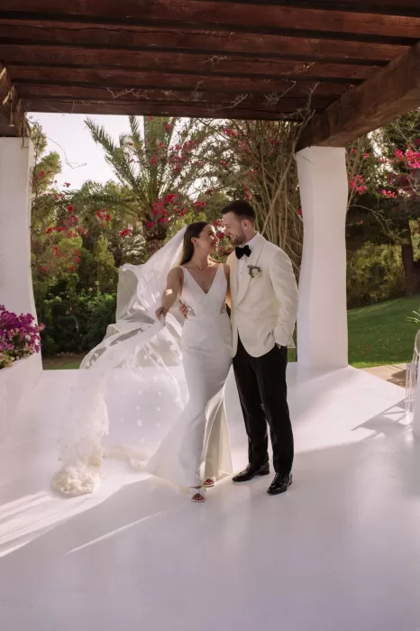 Bride and groom smiling together under a pergola at Villa Blue Star Ibiza.