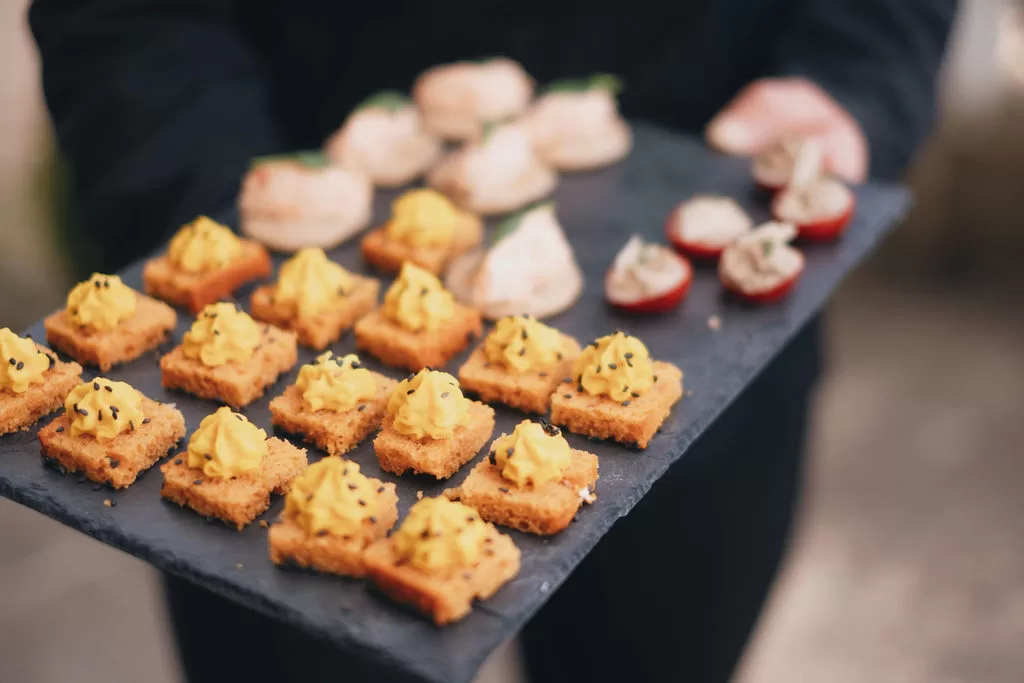 A tray of colourful gourmet canapés served during cocktail hour at Château de Jalesnes.