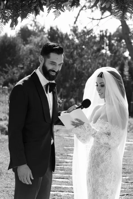 Outdoor wedding ceremony at Areias do Seixo, with the couple exchanging vows under soft sunlight.