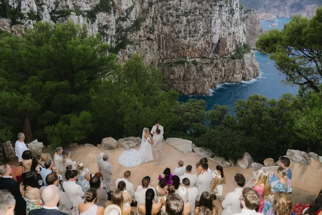 Wedding ceremony overlooking the dramatic cliffside and deep blue sea at Hacienda Na Xamena.