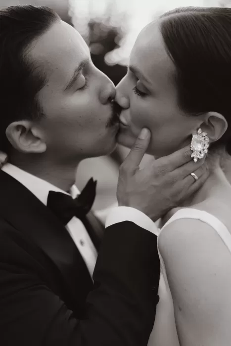 Intimate close-up of the couple sharing a soft kiss during their Masseria Spina wedding.