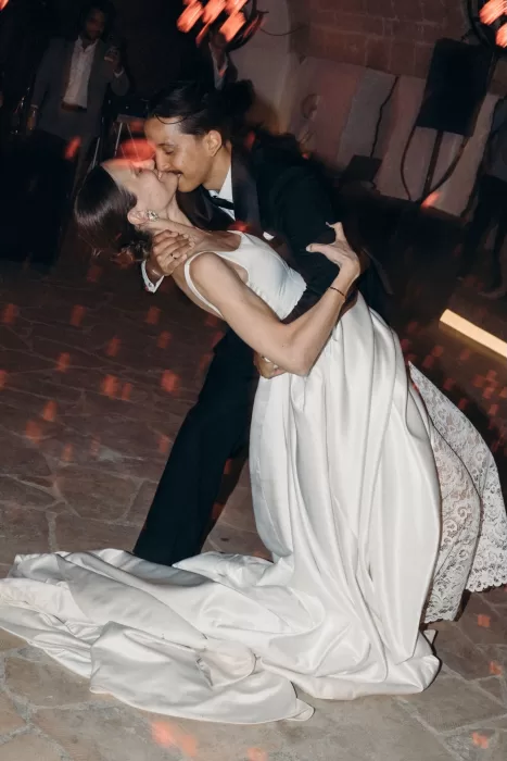 Couple sharing an emotional first dance at Masseria Spina, illuminated by warm, ambient lighting.