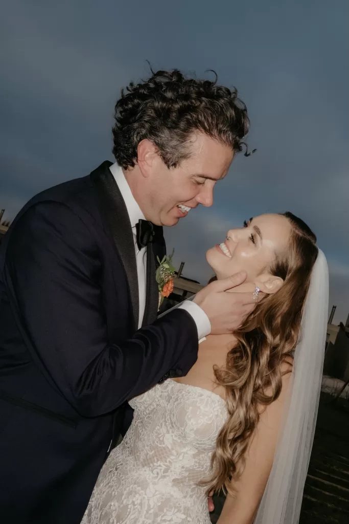 Groom holding the bride close during an intimate portrait at Areias do Seixo, captured just after the ceremony.