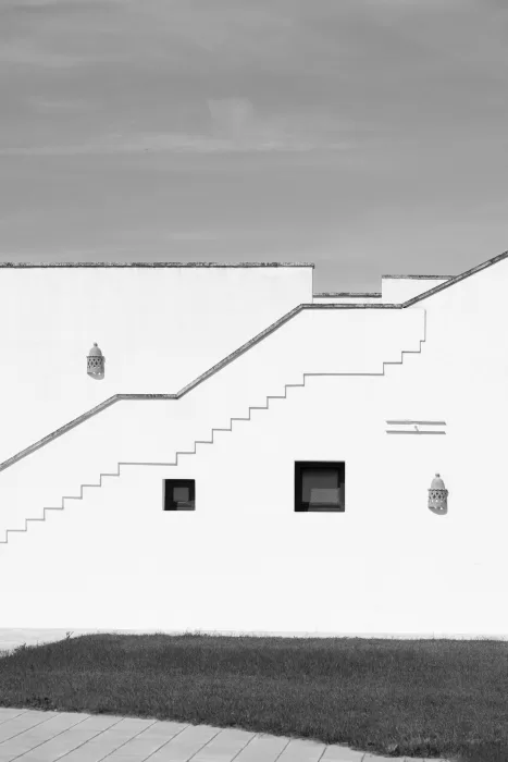 Minimalist black-and-white view of Masseria’s geometric staircase and clean architectural lines.