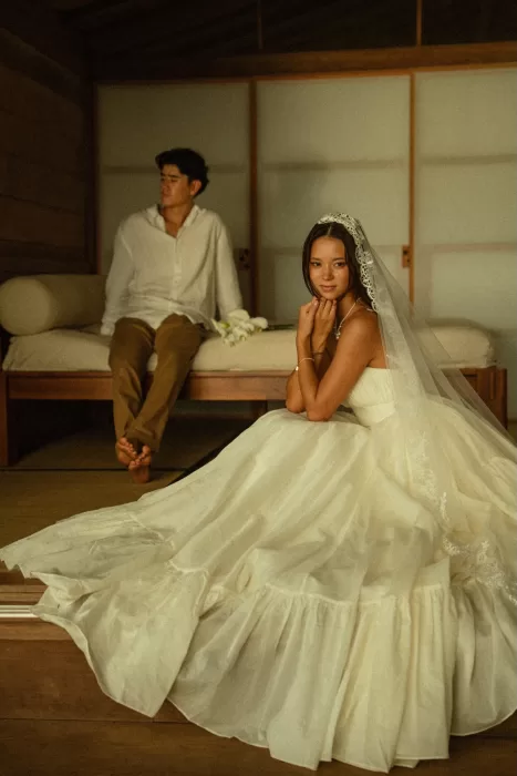 Bride resting inside the cabin, her dress flowing across the floor at Ossipoff’s Cabin in a calm, intimate moment.