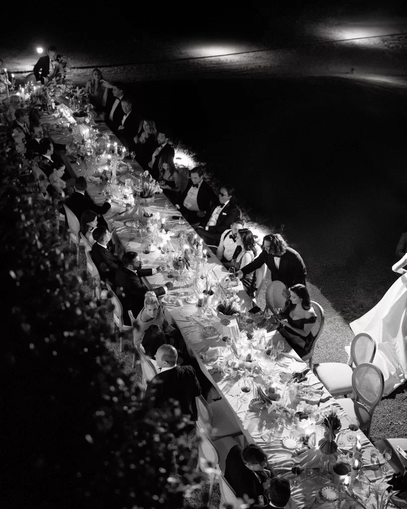 Overhead view of candlelit wedding dinner by the lake at Villa Lario Resort