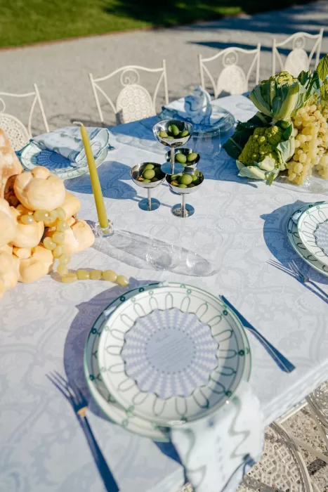 Wedding table styling with olives, bread and patterned plates at Villa Lario Resort