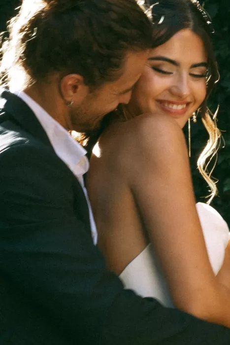 Intimate candid moment between the couple during golden hour at Finca Es Convent.