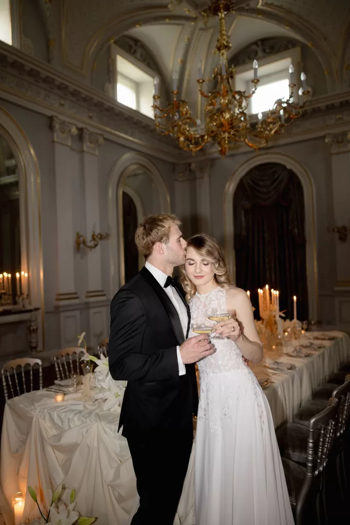 Bride and groom sharing a quiet toast during their candlelit reception at Grand Hotel du Lac.