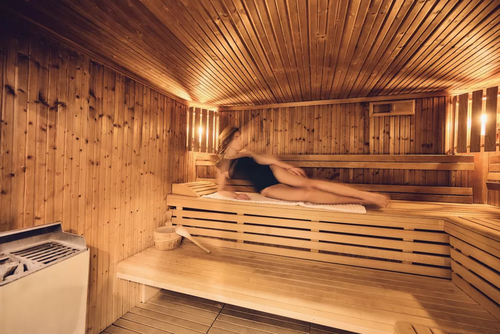 Warm wooden sauna at Grand Hotel du Lac with soft lighting, creating a serene wellness atmosphere before the wedding day.