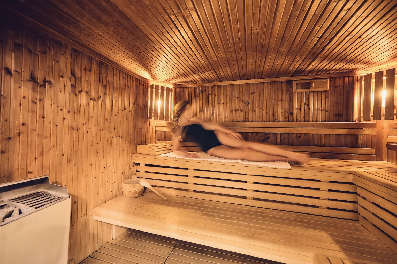 Warm wooden sauna at Grand Hotel du Lac with soft lighting, creating a serene wellness atmosphere before the wedding day.