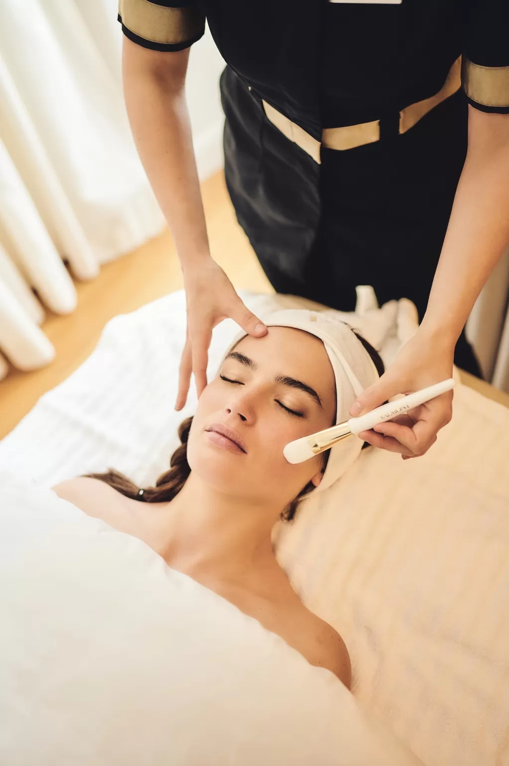 Bride enjoying a calming facial treatment at the Grand Hotel du Lac spa before the wedding day.
